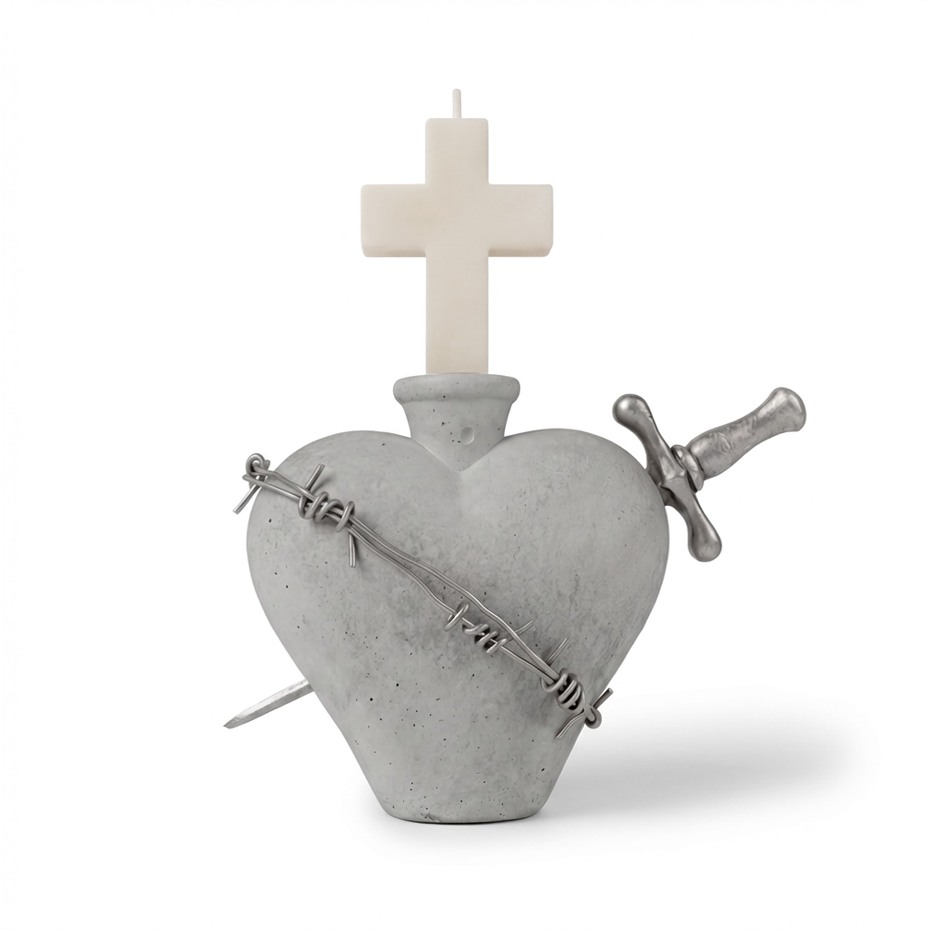 A grey stone heart-shaped candlestick wrapped in a silver barbed wire wreath, pierced by a silver dagger, holding a cross candle