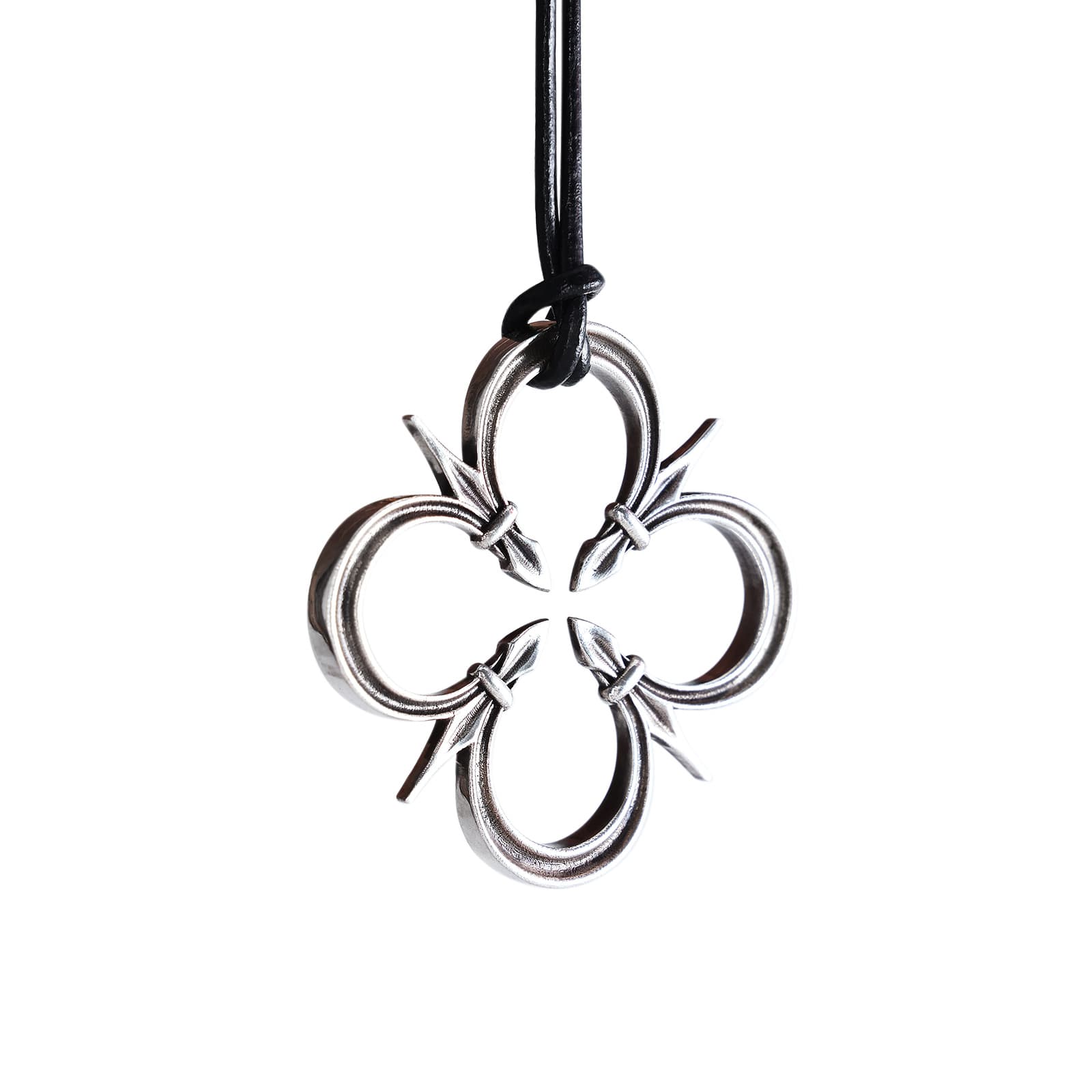 Silver Farr pendant shaped like a four-lobed gothic rose window on a black leather cord against a white background